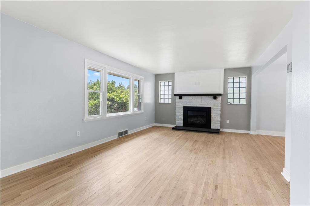 4030 Circle Drive Allison Park, PA 15101 - Photo 6 of 41 an empty room with windows and fireplace