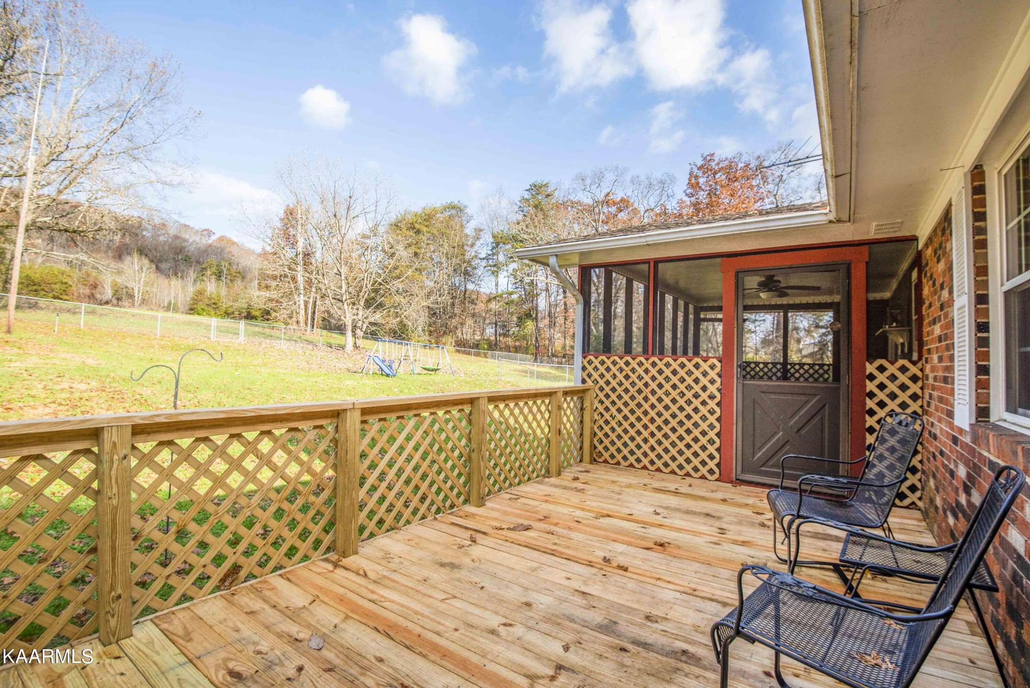 223 East Raccoon Valley Drive Heiskell, TN 37754 - Photo 42 of 55 a view of a balcony with wooden chairs