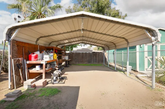 a balcony with table and chairs