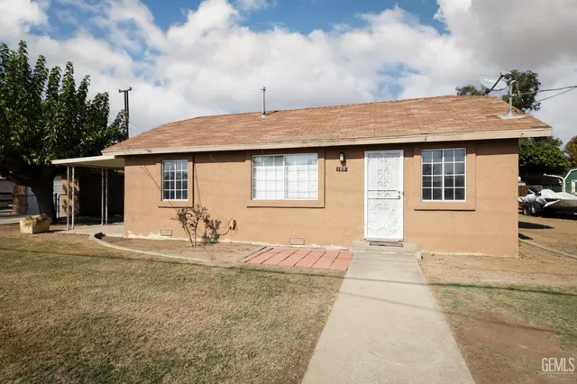a picture of a living room with furniture and wooden floor