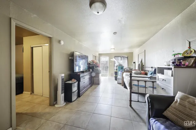 a bedroom with bed and a couch