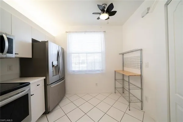 a kitchen with stainless steel appliances a refrigerator and a sink