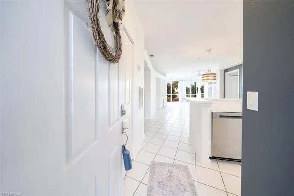 a view of entryway and kitchen