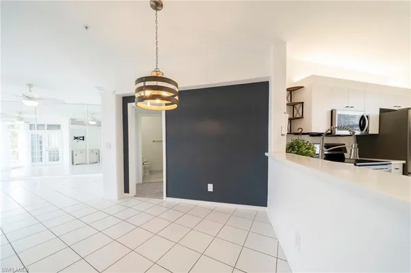 a kitchen view with stainless steel appliances a refrigerator and a stove