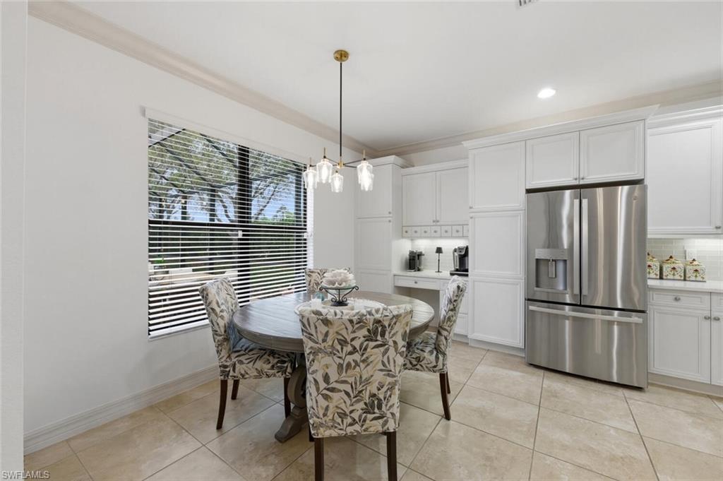 3306 Baltic Drive Naples, FL 34119 - Photo 16 of 49 a view of a dining room and chairs