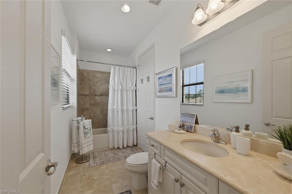 3306 Baltic Drive Naples, FL 34119 - Photo 29 of 49 a bathroom with a sink toilet and shower