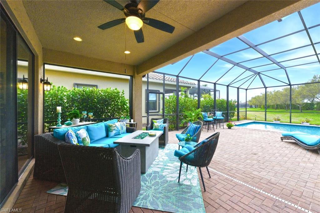 3306 Baltic Drive Naples, FL 34119 - Photo 41 of 49 a living room with furniture and a large window