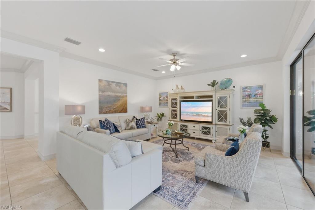 3306 Baltic Drive Naples, FL 34119 - Photo 5 of 49 a living room with furniture and potted plants