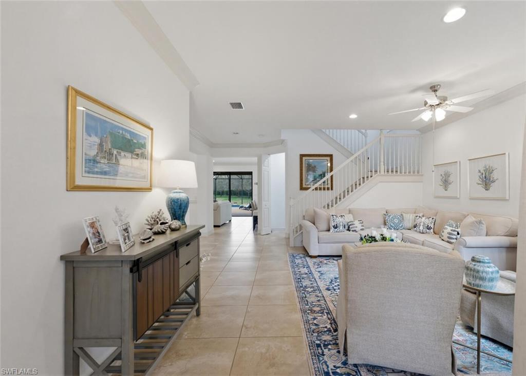 3306 Baltic Drive Naples, FL 34119 - Photo 7 of 49 a living room with furniture and wooden floor