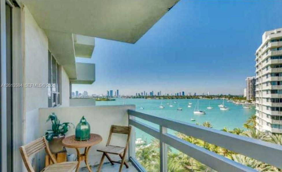 1500 Bay Road, Unit 1142S Miami Beach, FL 33139 - Photo 1 of 8 a view of a chair and table in the terrace
