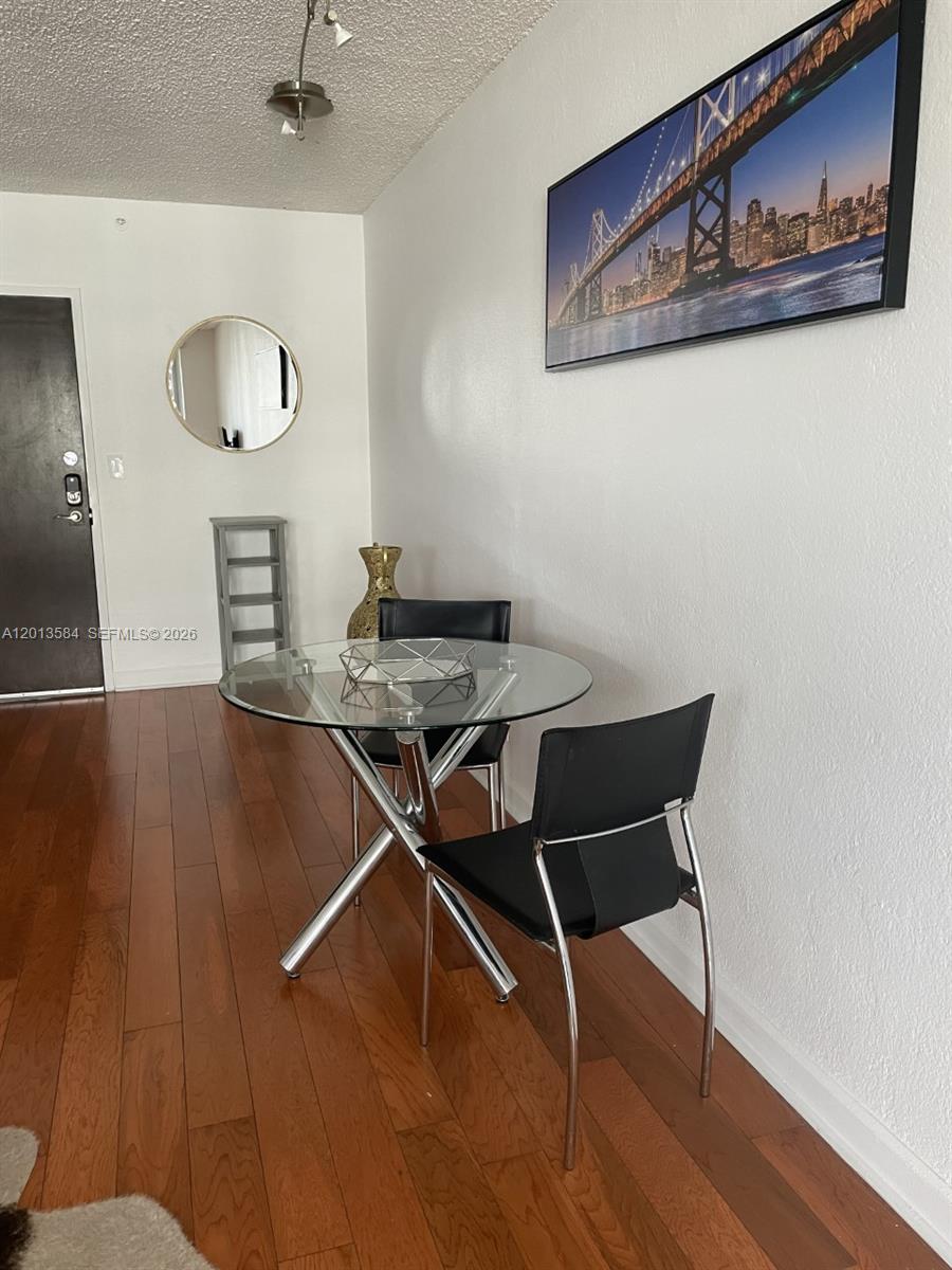 1500 Bay Road, Unit 1142S Miami Beach, FL 33139 - Photo 2 of 8 a view of a livingroom with furniture and wooden floor
