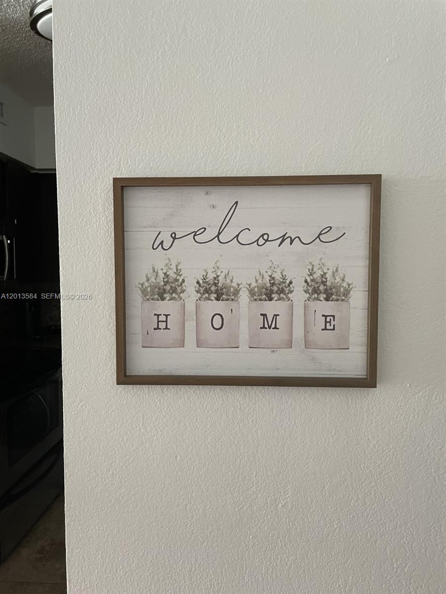 1500 Bay Road, Unit 1142S Miami Beach, FL 33139 - Photo 7 of 8 a white wall with a painting on the wall