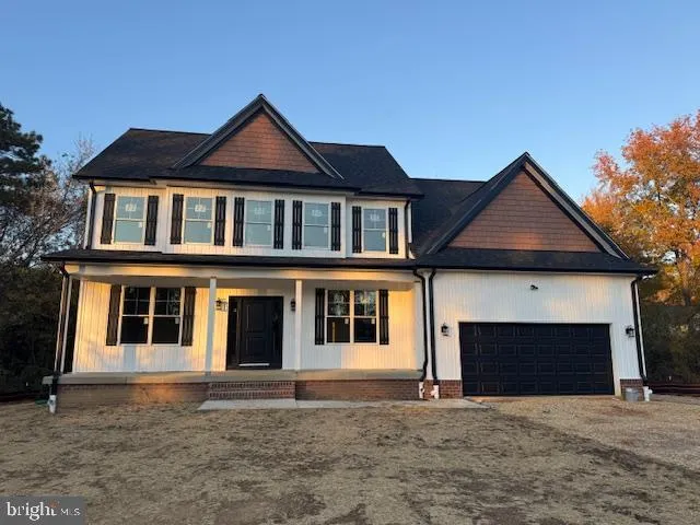 a front view of a house with yard