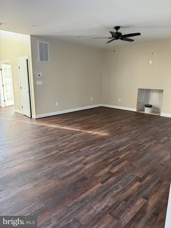 a view of a livingroom with wooden floor