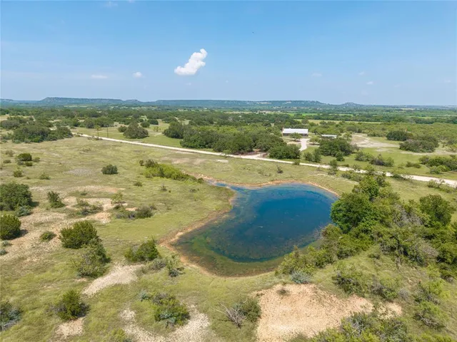 a view of a lake with houses in the background