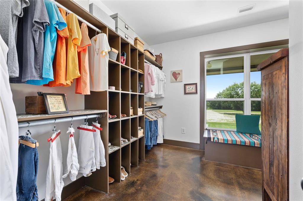 11253 County Road 525 May, TX 76857 - Photo 32 of 40 a view of walk in closet with clothes and shoes