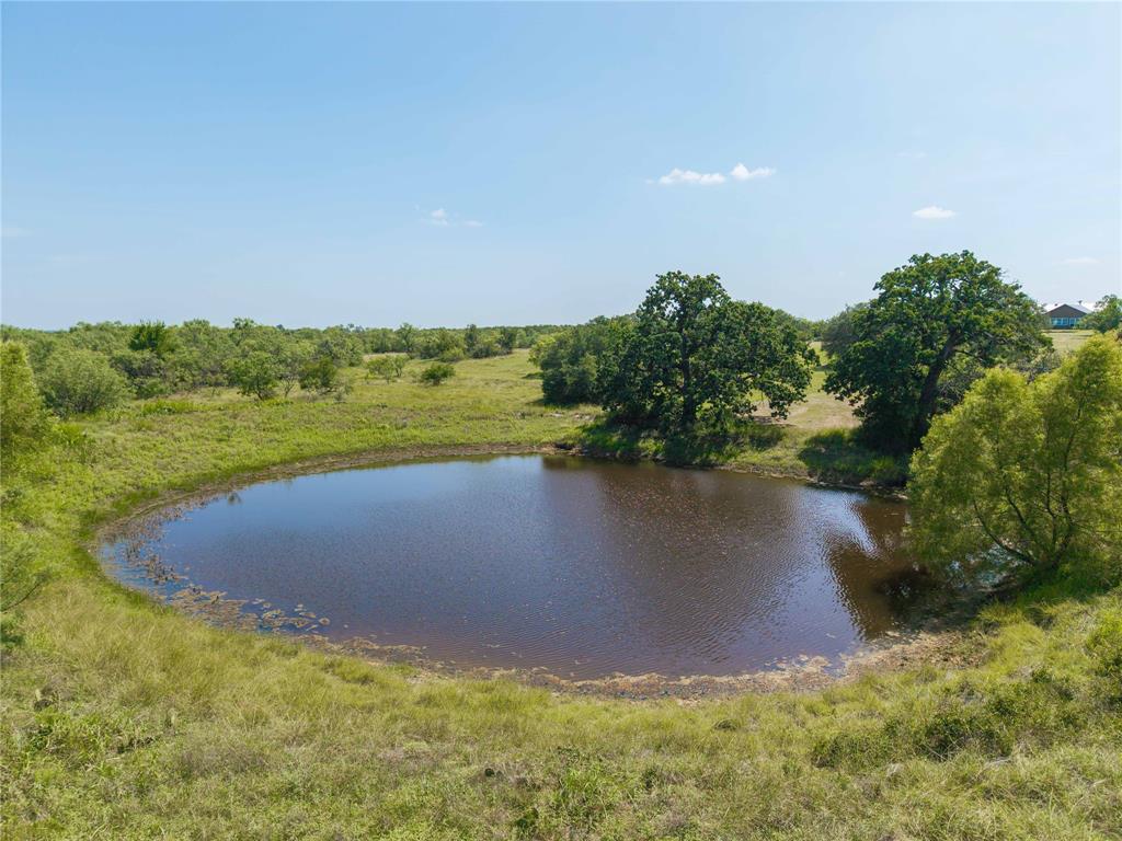 11253 County Road 525 May, TX 76857 - Photo 6 of 40 a view of a lake with a yard