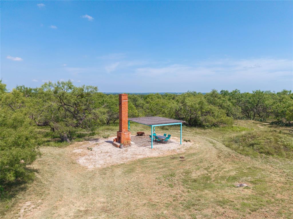 11253 County Road 525 May, TX 76857 - Photo 7 of 40 a view of a chairs and table in the yard
