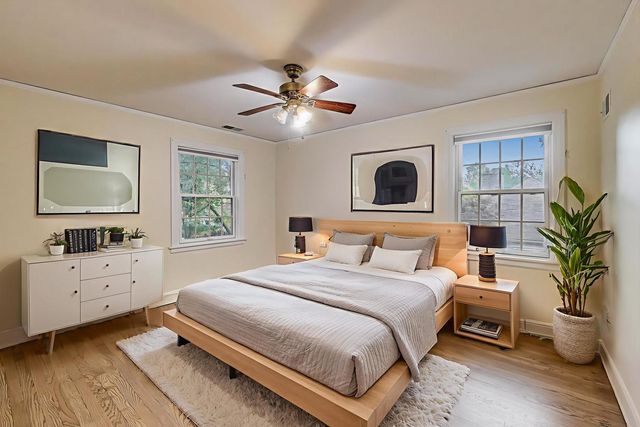 a bedroom with a large bed and a tv