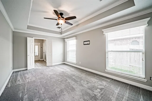 a view of room with window and ceiling fan