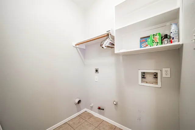 a view of backyard with small cabin and wooden fence