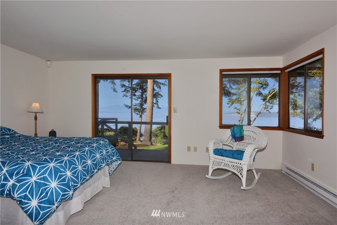 6924 Sills Road Clinton, WA 98236 - Photo 18 of 25 a bedroom with a bed and a window