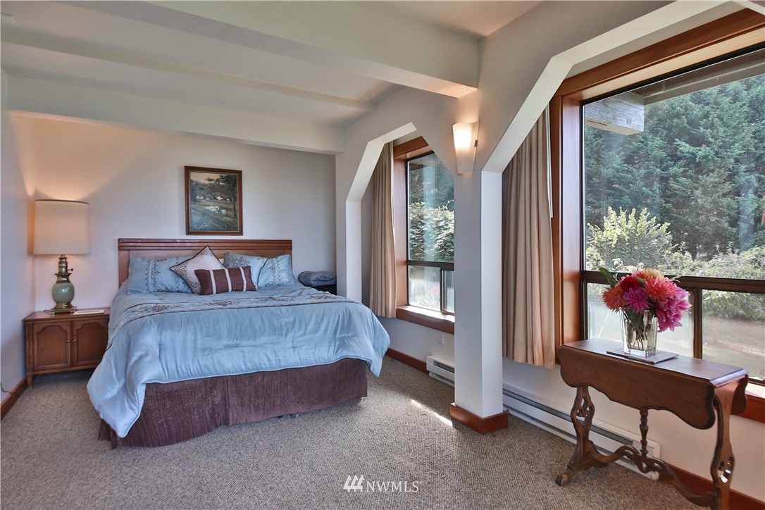 6924 Sills Road Clinton, WA 98236 - Photo 21 of 25 a bedroom with a bed and a window