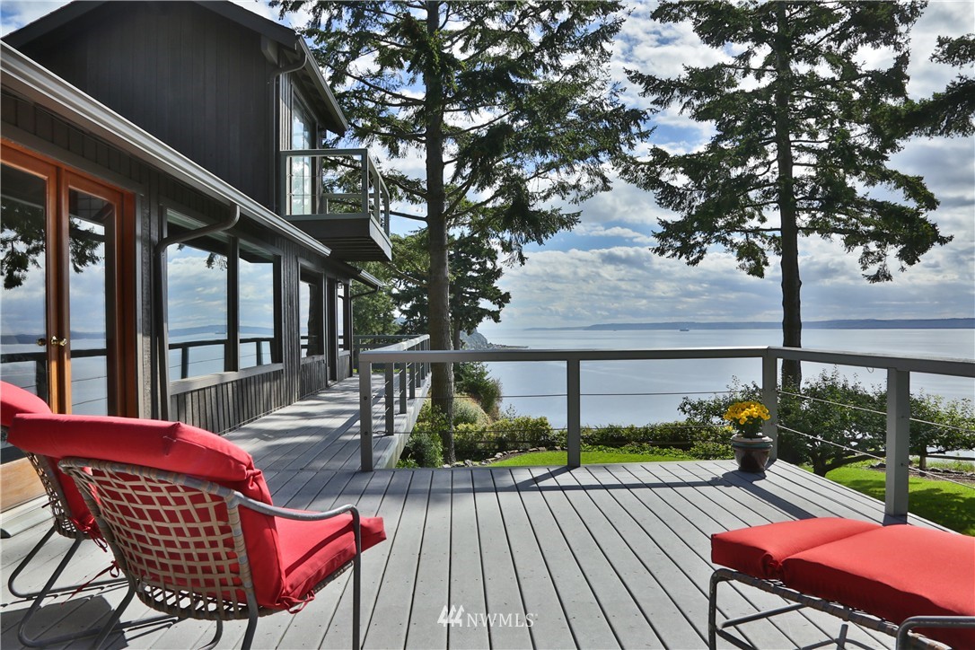 6924 Sills Road Clinton, WA 98236 - Photo 5 of 25 a view of a chairs and table on the deck