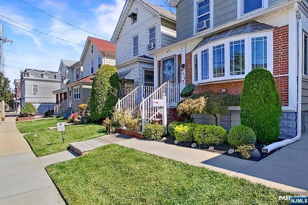 438 Forest Street Kearny, NJ 07032 - Photo 12 of 38 a view of a brick house with a yard and plants
