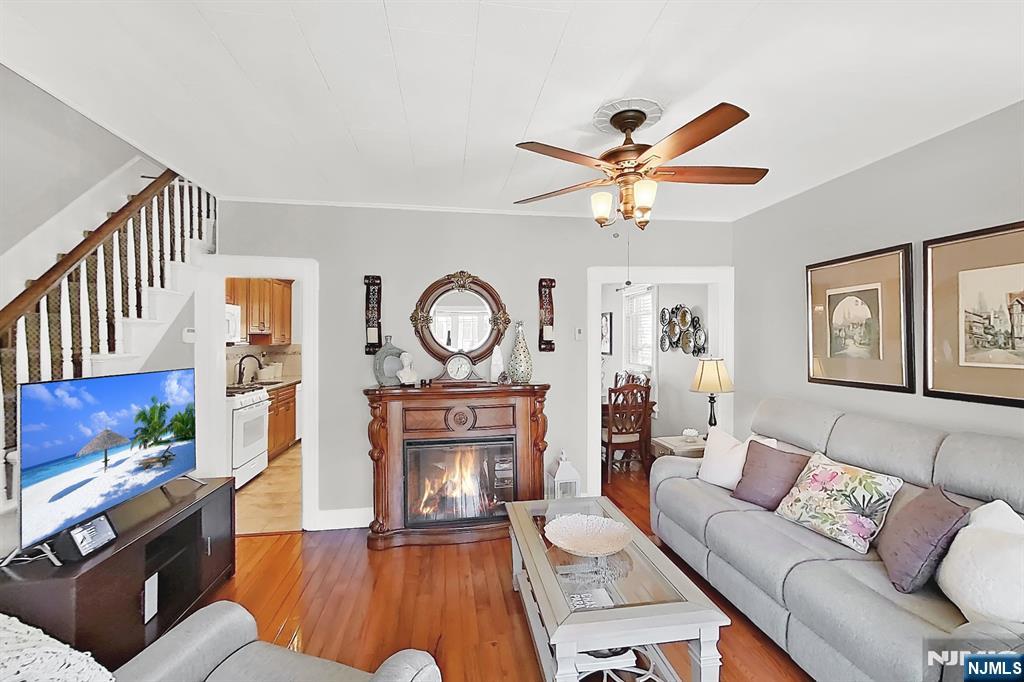 438 Forest Street Kearny, NJ 07032 - Photo 15 of 38 a living room with furniture a fireplace and a window