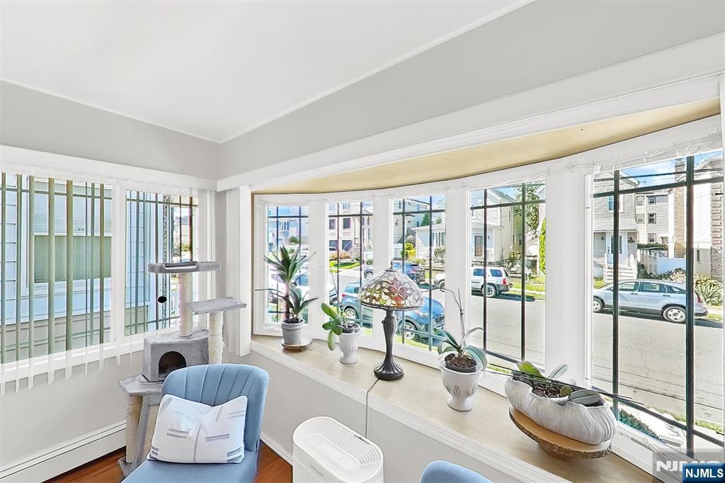 438 Forest Street Kearny, NJ 07032 - Photo 16 of 38 a room with furniture and floor to ceiling windows