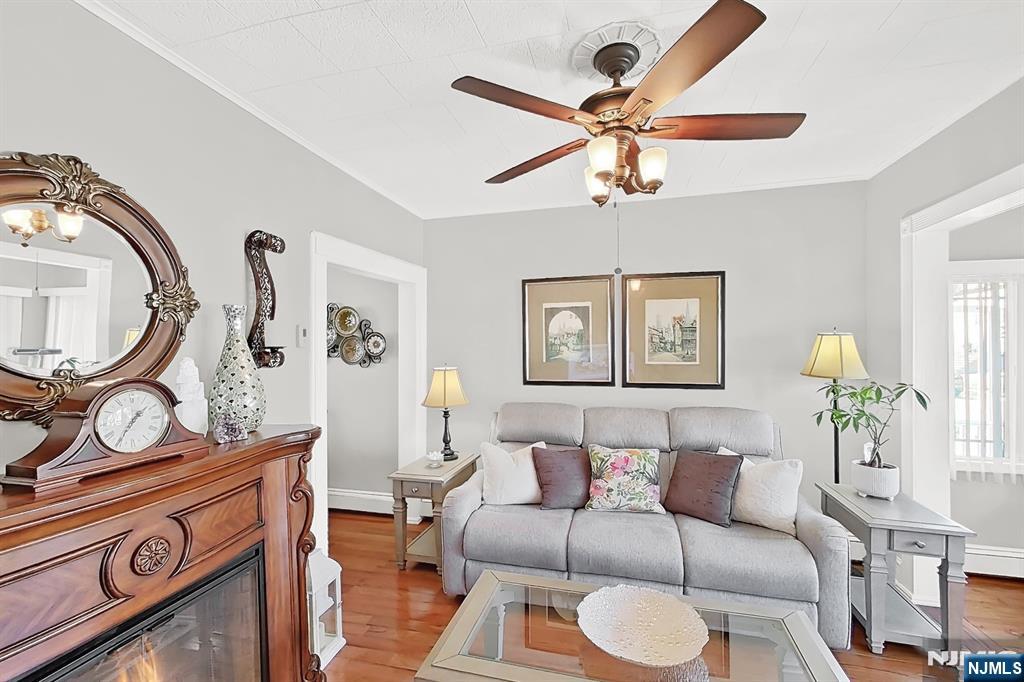 438 Forest Street Kearny, NJ 07032 - Photo 19 of 38 a living room with furniture a rug and a window