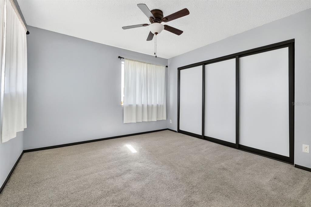 6525 Cape Sable Way Northeast, Unit 2 St. Petersburg, FL 33702 - Photo 12 of 26 a view of an empty room with a window