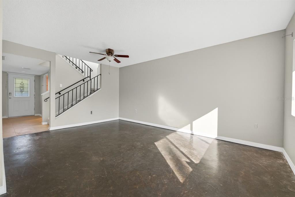6525 Cape Sable Way Northeast, Unit 2 St. Petersburg, FL 33702 - Photo 4 of 26 a view of a room with stairs and white walls