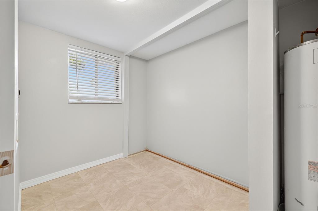 6525 Cape Sable Way Northeast, Unit 2 St. Petersburg, FL 33702 - Photo 7 of 26 a view of an empty room with a window