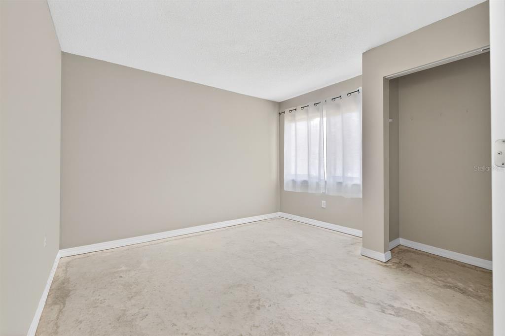 6525 Cape Sable Way Northeast, Unit 2 St. Petersburg, FL 33702 - Photo 8 of 26 a view of an empty room with a window