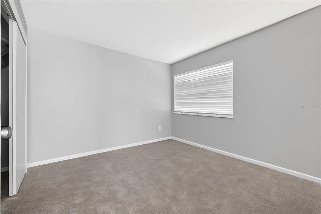 6525 Cape Sable Way Northeast, Unit 2 St. Petersburg, FL 33702 - Photo 10 of 26 an empty room with windows