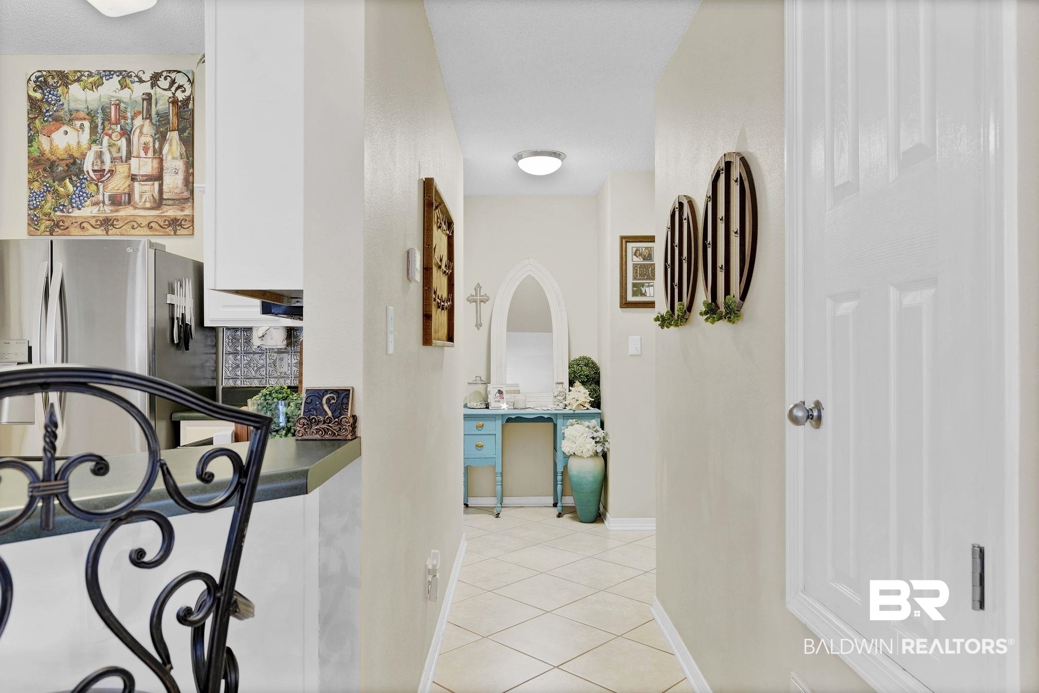 11103 Pontchartrain Loop Daphne, AL 36526 - Photo 19 of 29 Hall with light tile patterned flooring, arched walkways, and baseboards