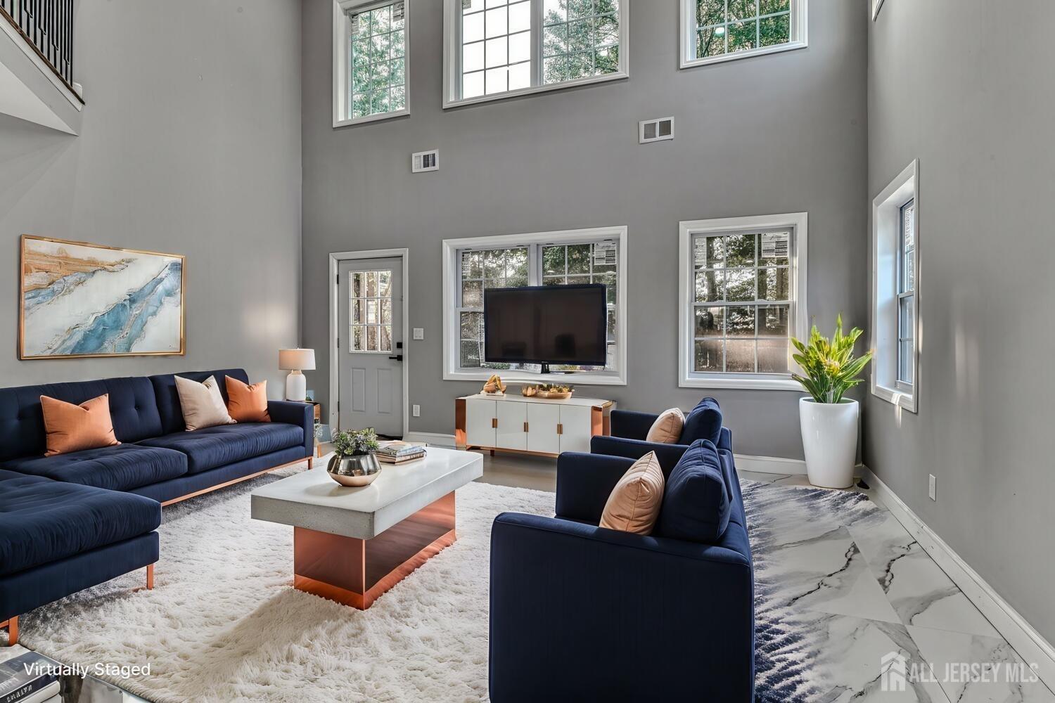 31 Ashley Road Edison, NJ 08817 - Photo 12 of 47 a living room with furniture and a flat screen tv