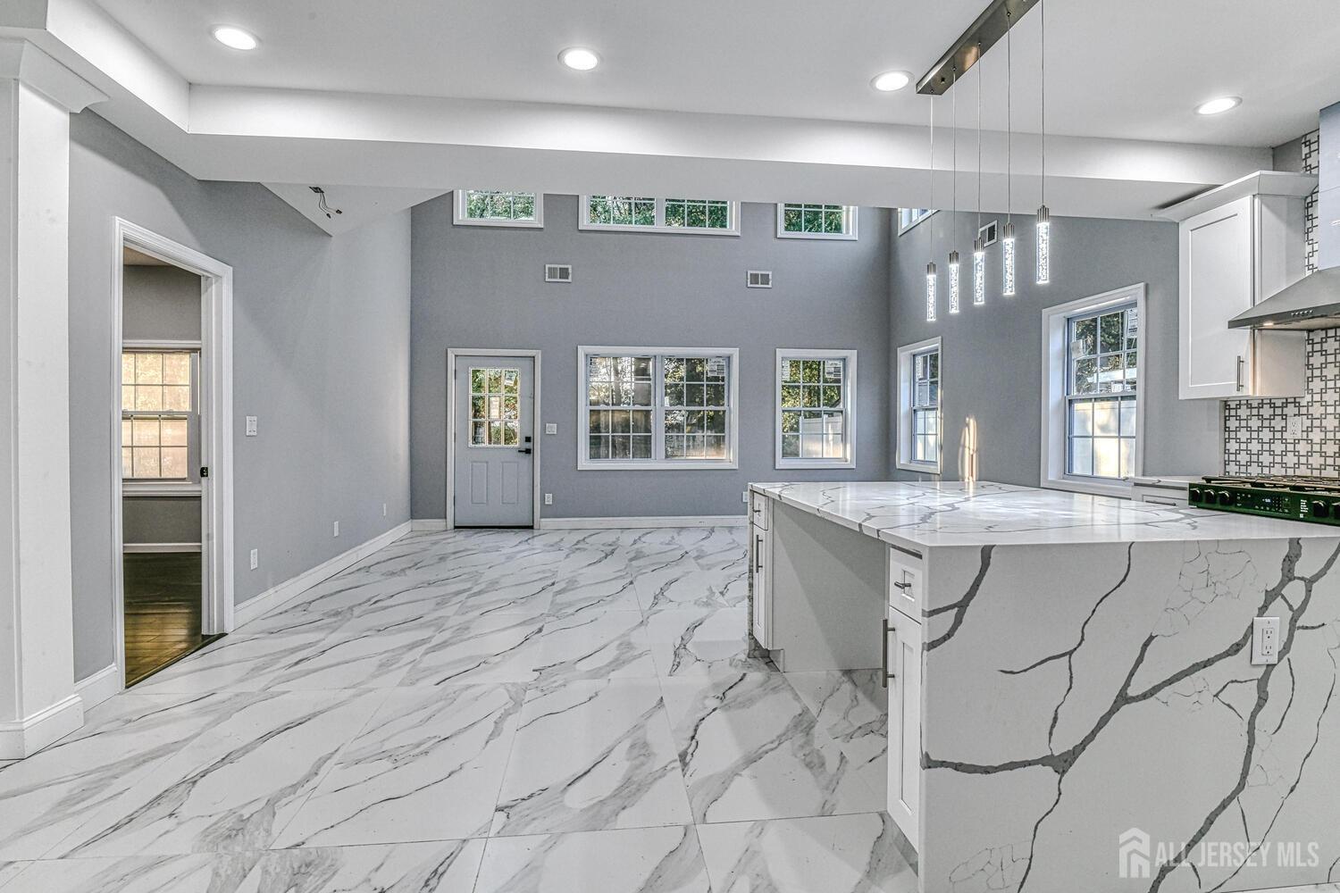 31 Ashley Road Edison, NJ 08817 - Photo 14 of 47 a spacious bathroom with a granite countertop sink a toilet and mirror