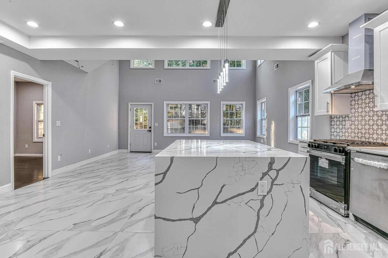 31 Ashley Road Edison, NJ 08817 - Photo 15 of 47 a spacious kitchen with stainless steel appliances granite countertop a stove and a refrigerator