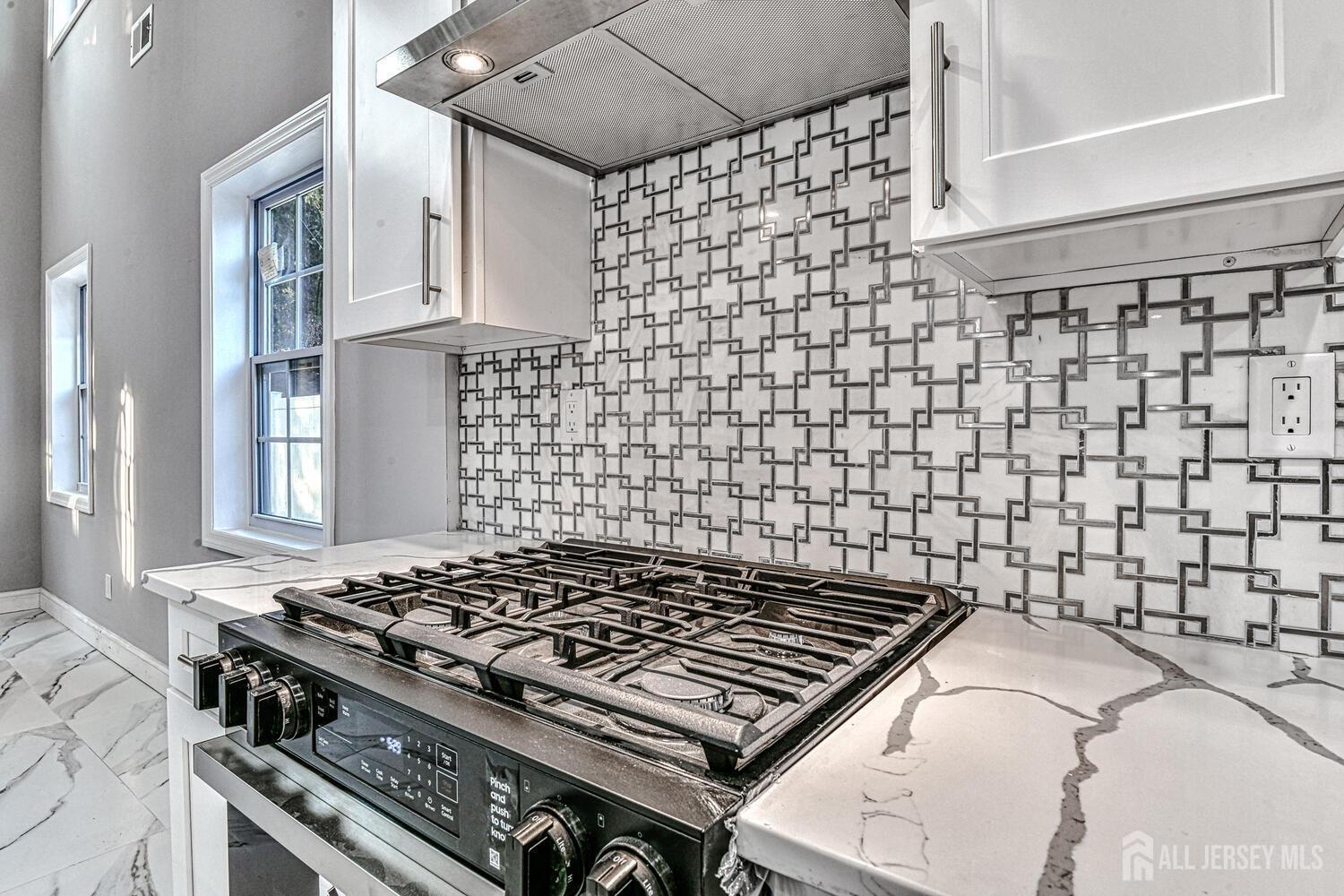 31 Ashley Road Edison, NJ 08817 - Photo 16 of 47 a stove top oven sitting inside of a kitchen