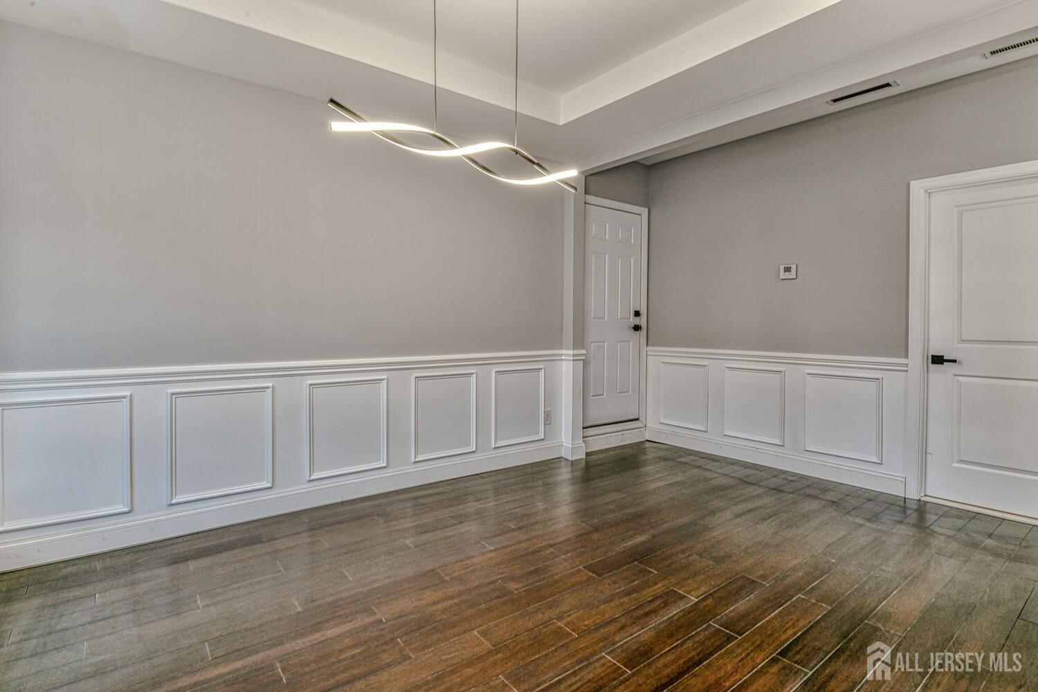31 Ashley Road Edison, NJ 08817 - Photo 21 of 47 a view of an empty room with wooden floor