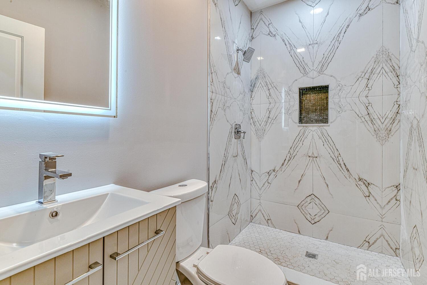 31 Ashley Road Edison, NJ 08817 - Photo 24 of 47 a bathroom with a sink toilet and shower