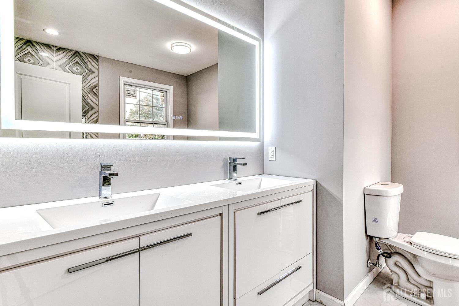 31 Ashley Road Edison, NJ 08817 - Photo 35 of 47 a bathroom with a sink and a toilet