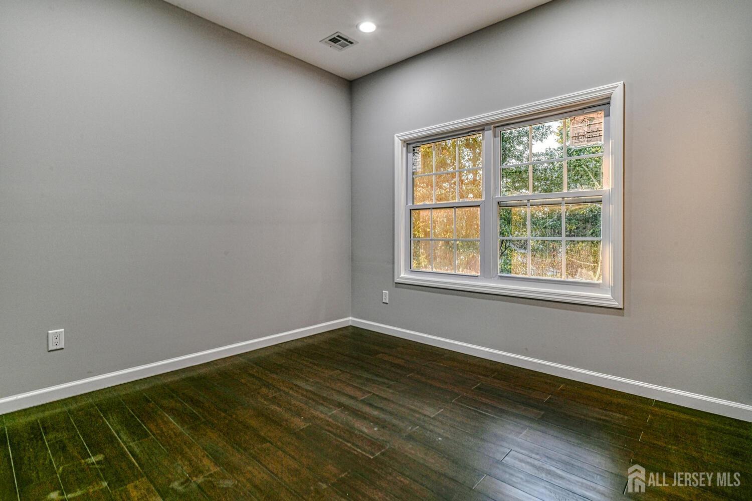 31 Ashley Road Edison, NJ 08817 - Photo 40 of 47 a view of a room with wooden floor and windows