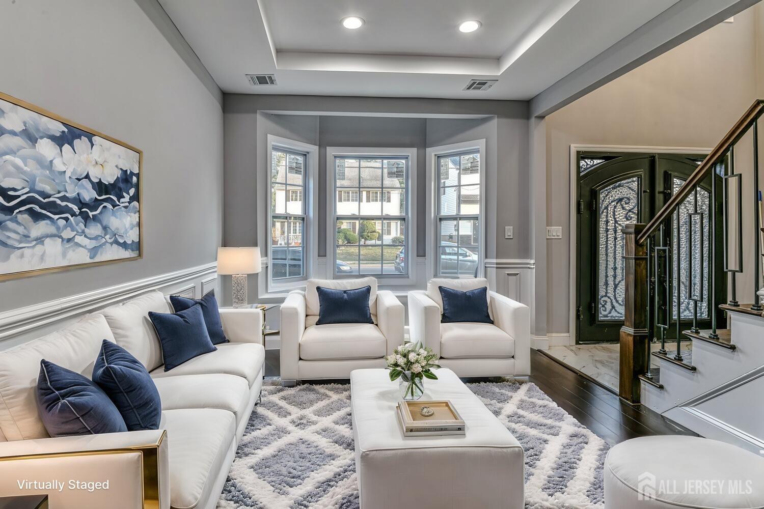 31 Ashley Road Edison, NJ 08817 - Photo 5 of 47 a living room with furniture and a large window