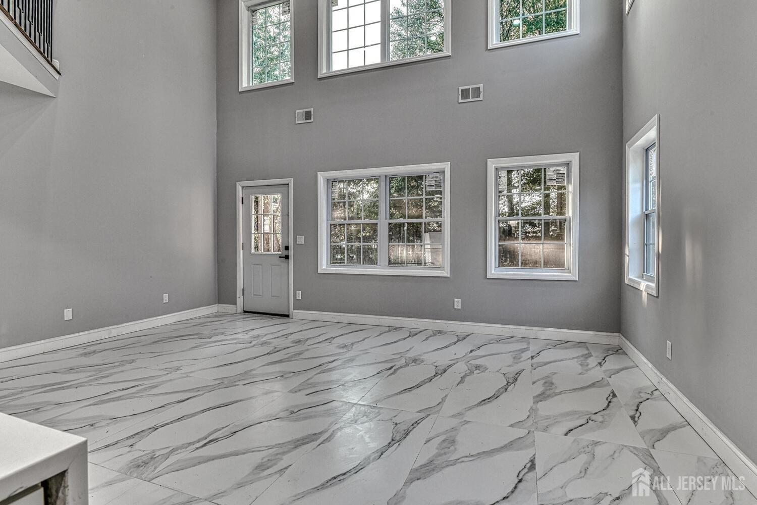 31 Ashley Road Edison, NJ 08817 - Photo 9 of 47 a view of an empty room with a window