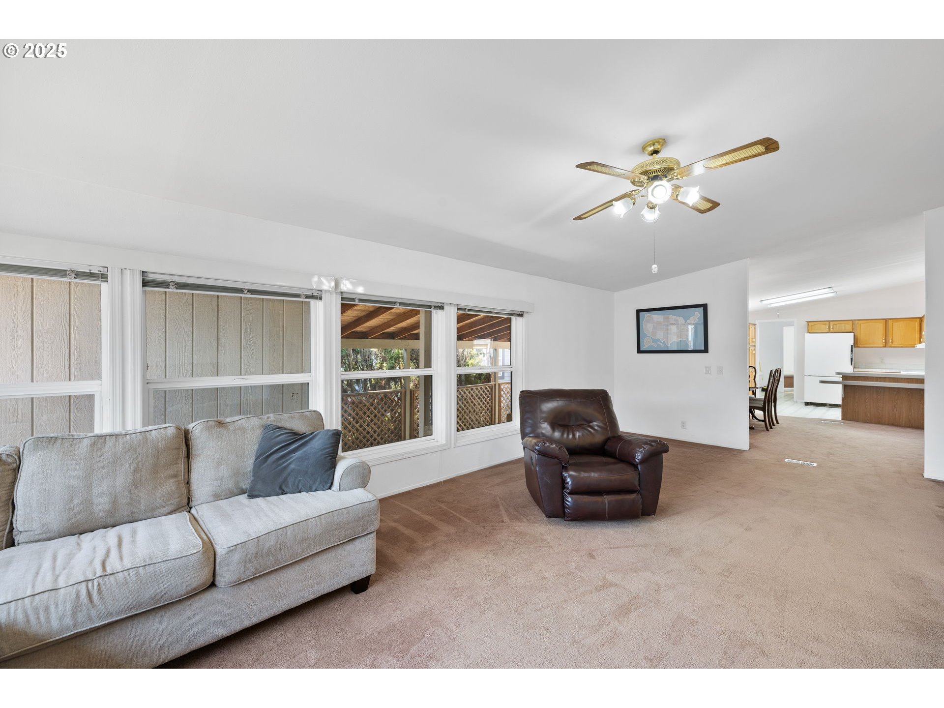 1949 Southeast Palmquist Road, Unit 121 Gresham, OR 97080 - Photo 14 of 37 a living room with furniture and a large window