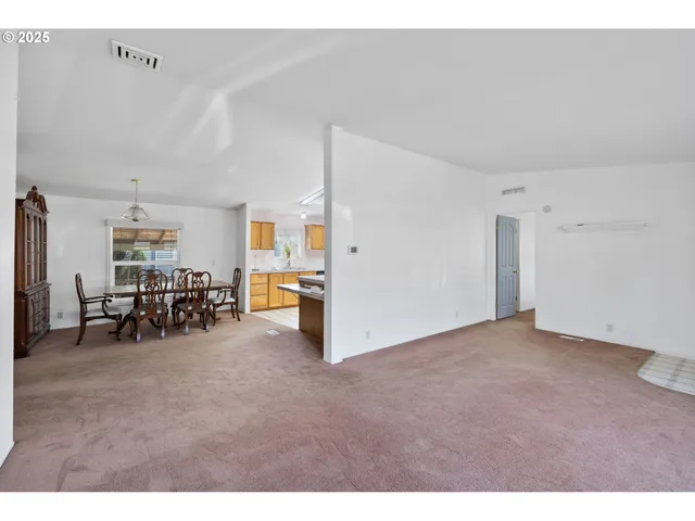 a view of a livingroom with furniture and white cabinet